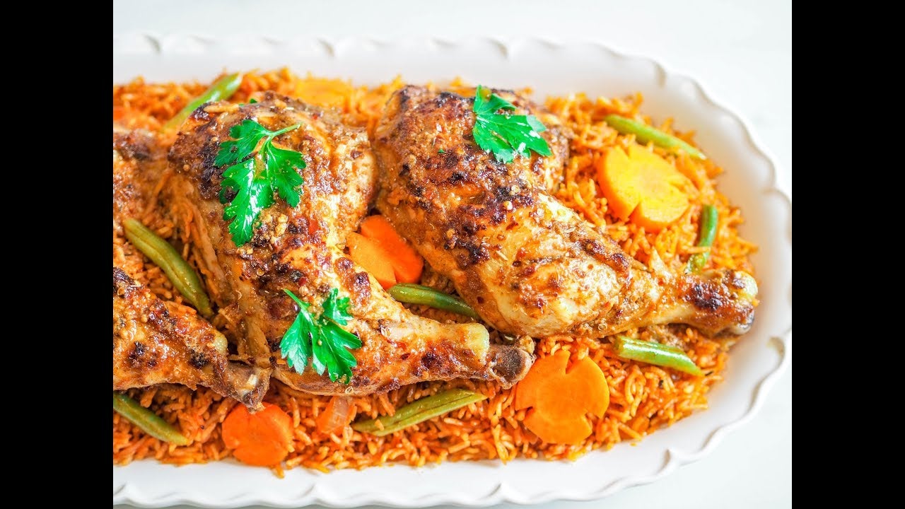 Jollof Rice and Chicken with Coleslaw - Travelandmunchies